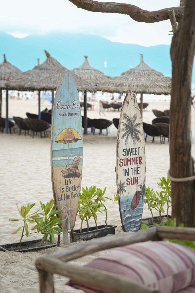 Casa Bay surfboards on the beach — Life is Better at the Beach